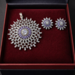 Elegant silver polish AD pendant set with sparkling stones and matching earrings.